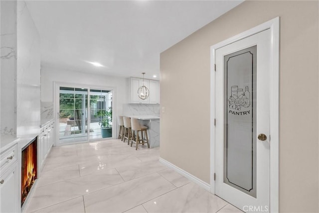 1115 E Sierra Madre Ave, Glendora, CA 91741 - corridor with light marble finish flooring and baseboards