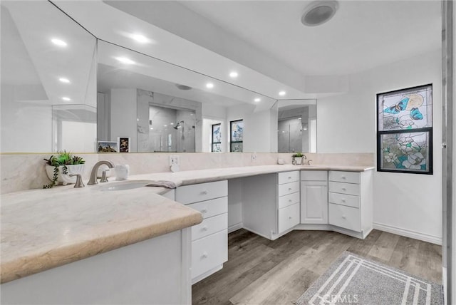 1115 E Sierra Madre Ave, Glendora, CA 91741 - bathroom featuring a marble finish shower, vanity, recessed lighting, and wood finished floors