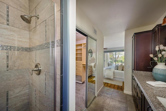 12870 Circulo Dardo, San Diego, CA 92128 - full bathroom featuring a stall shower, connected bathroom, vanity, and a walk in closet