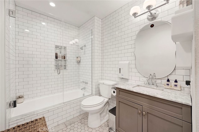 1118 Valencia St Unit 120, Los Angeles, CA 90015 - bathroom with tile walls, tile patterned flooring, tiled shower / bath combo, vanity, and backsplash