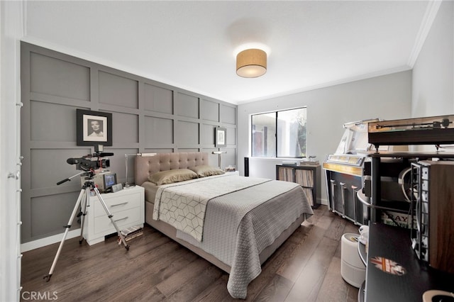1118 Valencia St Unit 120, Los Angeles, CA 90015 - bedroom featuring ornamental molding, a decorative wall, and dark wood-style flooring