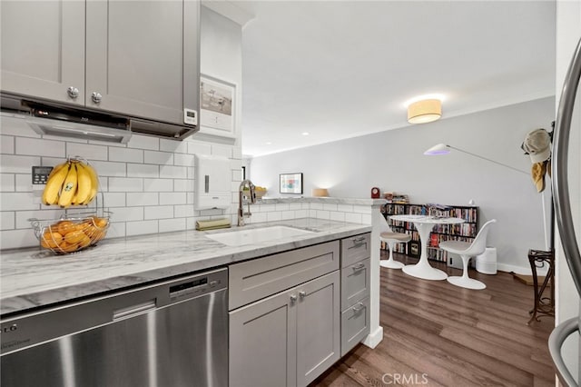 1118 Valencia St Unit 120, Los Angeles, CA 90015 - kitchen with dishwasher, backsplash, ornamental molding, a peninsula, and light stone countertops