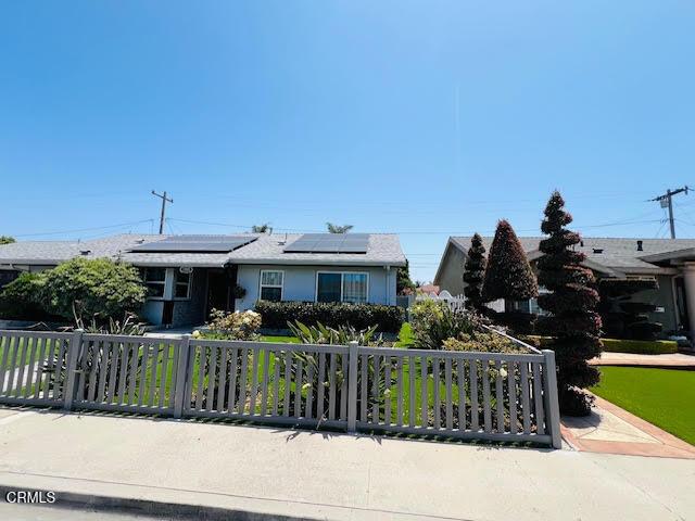 1900 Piedmont St, Oxnard, CA 93035 - view of front of property featuring a fenced front yard and solar panels