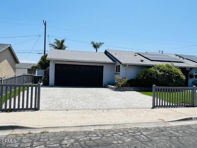1900 Piedmont St, Oxnard, CA 93035 - ranch-style house with an attached garage, decorative driveway, and stucco siding