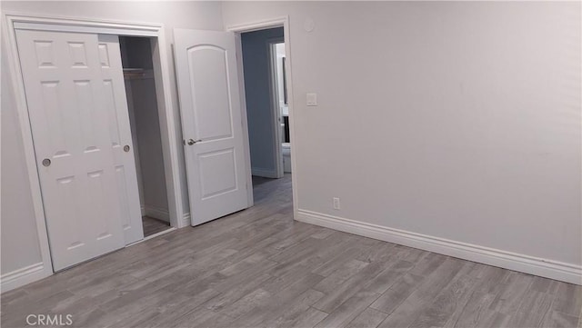 8649 Cantaloupe Ave, Panorama City, CA 91402 - unfurnished bedroom featuring wood finished floors and a closet