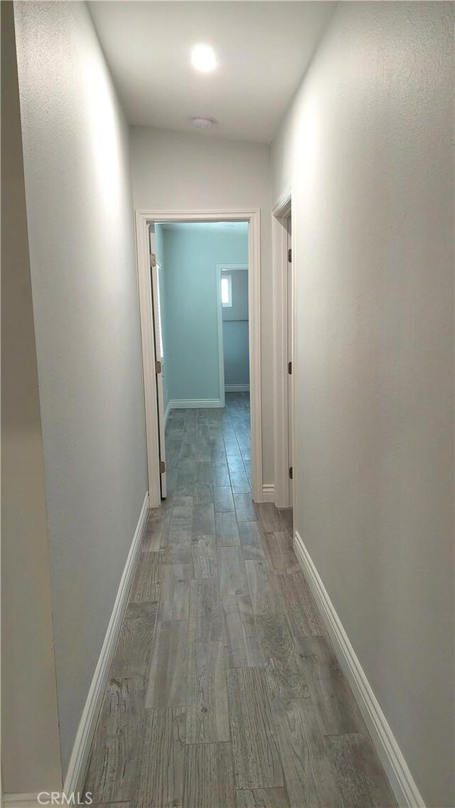 8649 Cantaloupe Ave, Panorama City, CA 91402 - corridor featuring wood finished floors and baseboards