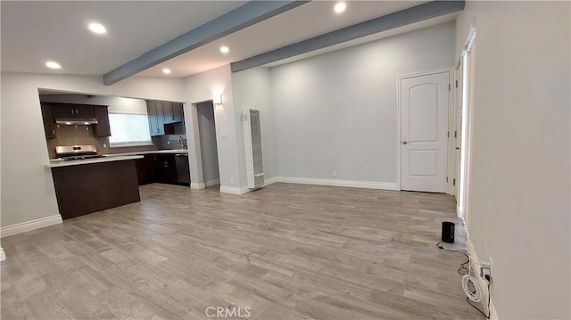 8649 Cantaloupe Ave, Panorama City, CA 91402 - kitchen with recessed lighting, light countertops, dark brown cabinets, a heating unit, and light wood-type flooring