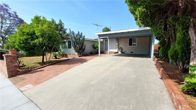 8649 Cantaloupe Ave, Panorama City, CA 91402 - ranch-style home with driveway, stucco siding, and a carport