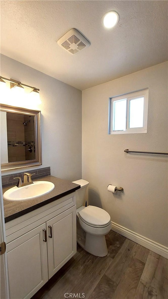 8649 Cantaloupe Ave, Panorama City, CA 91402 - full bath with wood finished floors, vanity, a shower, and a textured ceiling
