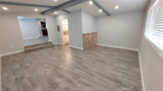 8649 Cantaloupe Ave, Panorama City, CA 91402 - unfurnished living room featuring light wood-style floors, beam ceiling, and recessed lighting