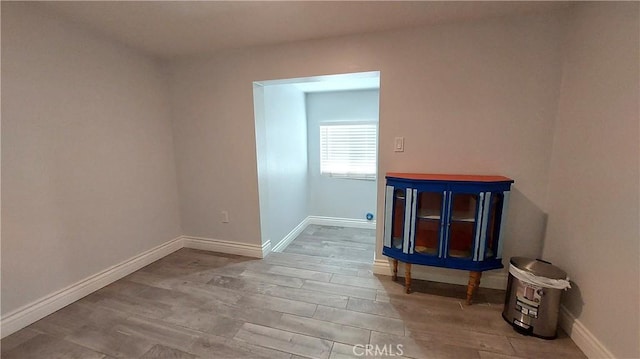 8649 Cantaloupe Ave, Panorama City, CA 91402 - unfurnished room with baseboards and wood finished floors