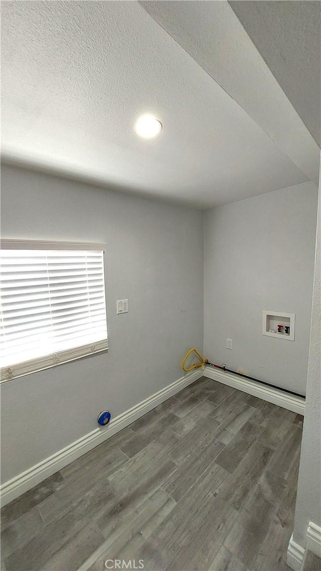 8649 Cantaloupe Ave, Panorama City, CA 91402 - unfurnished room featuring wood finished floors and a textured ceiling