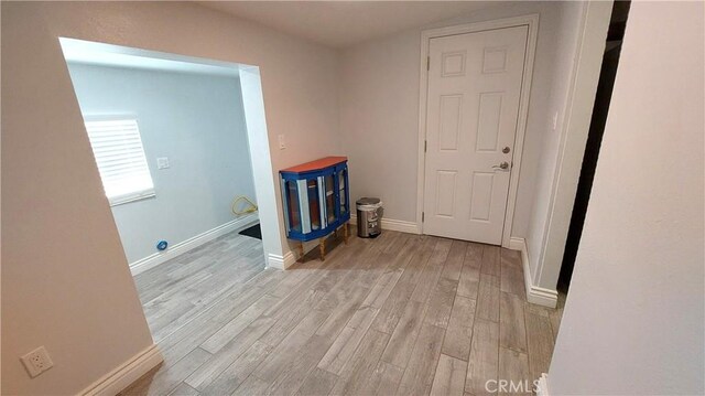 8649 Cantaloupe Ave, Panorama City, CA 91402 - washroom featuring light wood-type flooring and baseboards