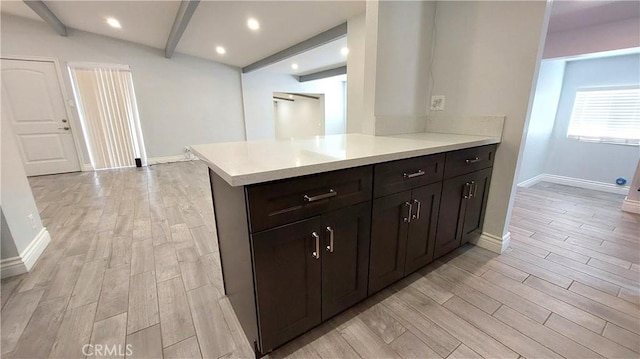 8649 Cantaloupe Ave, Panorama City, CA 91402 - kitchen featuring beam ceiling, light wood-style flooring, light countertops, and recessed lighting