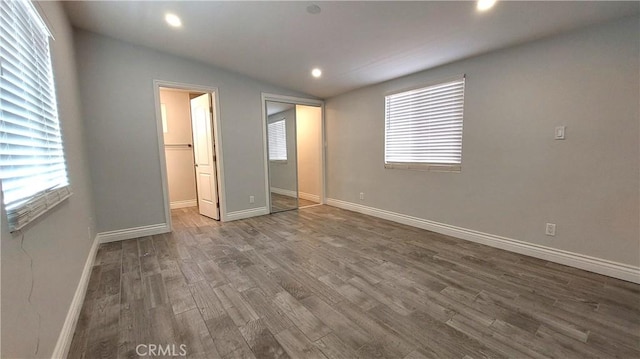 8649 Cantaloupe Ave, Panorama City, CA 91402 - unfurnished bedroom with vaulted ceiling, wood finished floors, a closet, and recessed lighting