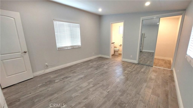 8649 Cantaloupe Ave, Panorama City, CA 91402 - unfurnished bedroom featuring recessed lighting, wood finished floors, connected bathroom, and a closet
