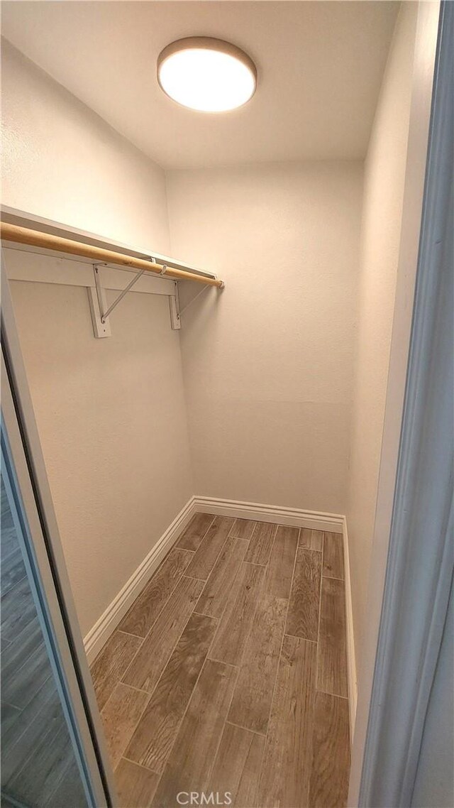 8649 Cantaloupe Ave, Panorama City, CA 91402 - spacious closet featuring wood finished floors