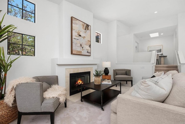 3649 Azure Cir, Carlsbad, CA 92008 - carpeted living room featuring a tiled fireplace, recessed lighting, and a skylight