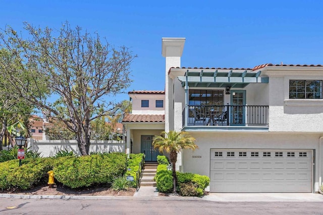 3649 Azure Cir, Carlsbad, CA 92008 - mediterranean / spanish-style home with a balcony, stucco siding, an attached garage, and a tiled roof