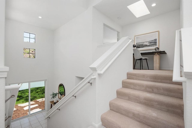 3649 Azure Cir, Carlsbad, CA 92008 - stairs with a skylight, plenty of natural light, tile patterned floors, a high ceiling, and recessed lighting
