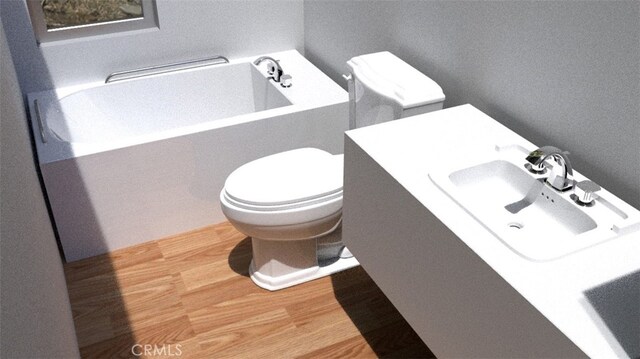 6577 Morongo Rd Unit 29, Palms, CA 92277 - bathroom featuring wood finished floors, a bathtub, and vanity