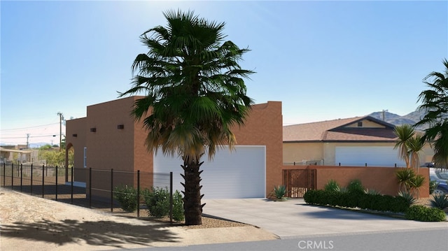 6577 Morongo Rd Unit 29, Palms, CA 92277 - view of front of home with driveway and stucco siding