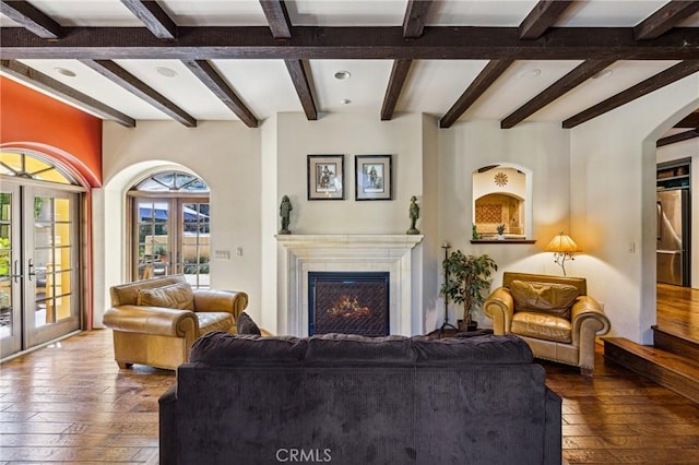 935 Isabella Way, San Luis Obispo, CA 93405 - living area with hardwood / wood-style floors, beamed ceiling, a lit fireplace, arched walkways, and french doors