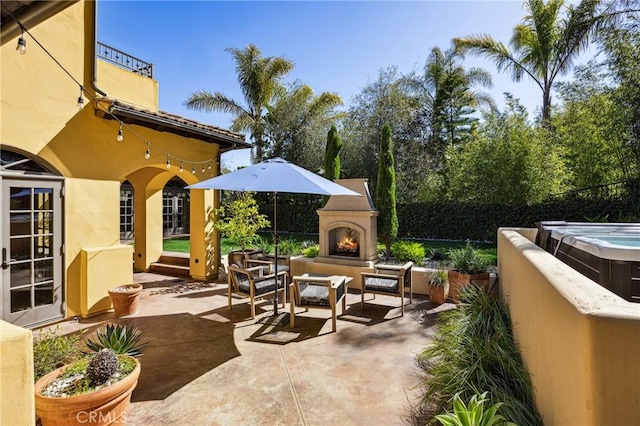 935 Isabella Way, San Luis Obispo, CA 93405 - view of patio with a lit fireplace and a hot tub