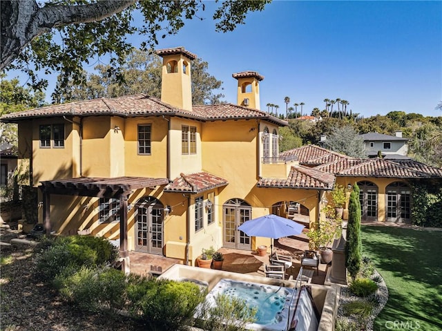935 Isabella Way, San Luis Obispo, CA 93405 - back of property with french doors, a chimney, a tiled roof, stucco siding, and a patio