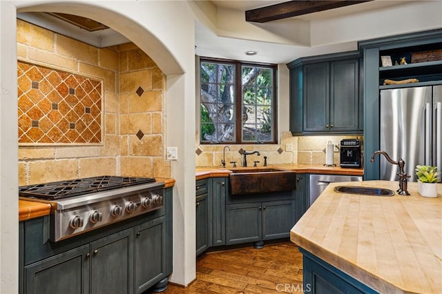 935 Isabella Way, San Luis Obispo, CA 93405 - kitchen with butcher block counters, backsplash, stainless steel appliances, dark wood-style flooring, and beam ceiling