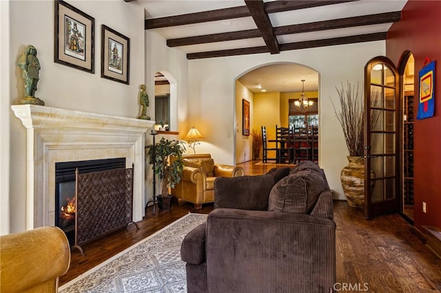 935 Isabella Way, San Luis Obispo, CA 93405 - living area with wood-type flooring, beamed ceiling, arched walkways, a chandelier, and a high end fireplace