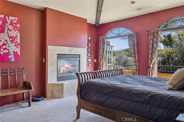 935 Isabella Way, San Luis Obispo, CA 93405 - carpeted bedroom with multiple windows, a tiled fireplace, and beamed ceiling