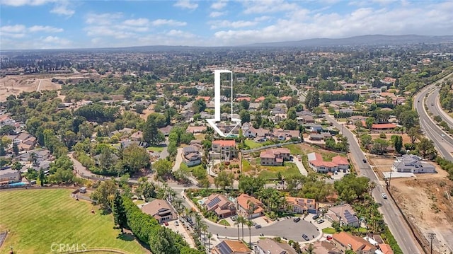 6041 Calle Mirador, Yorba Linda, CA 92886 - aerial view of property's location featuring a mountainous background and nearby suburban area
