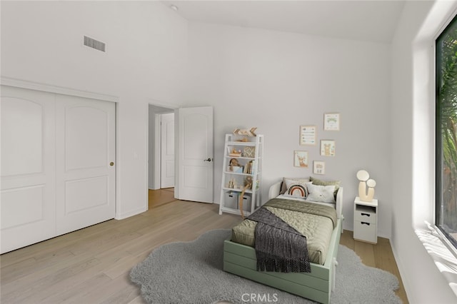 6041 Calle Mirador, Yorba Linda, CA 92886 - bedroom with wood finished floors, a towering ceiling, and a closet