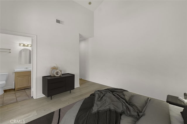 6041 Calle Mirador, Yorba Linda, CA 92886 - bedroom with high vaulted ceiling, light wood-type flooring, and ensuite bathroom