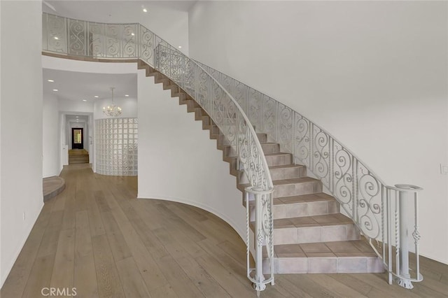 6041 Calle Mirador, Yorba Linda, CA 92886 - stairs with a towering ceiling, a chandelier, hardwood / wood-style floors, and recessed lighting