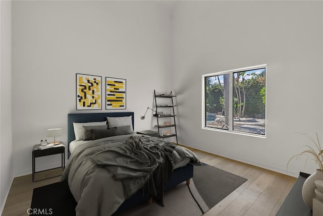 6041 Calle Mirador, Yorba Linda, CA 92886 - bedroom featuring a towering ceiling and wood finished floors