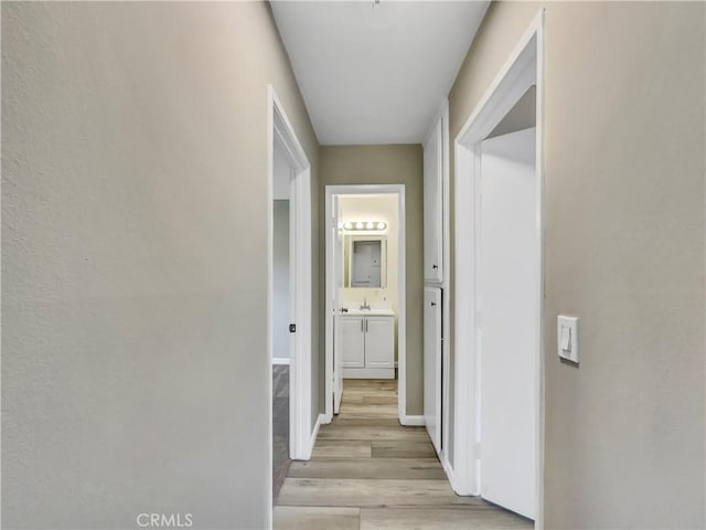 1920 N H St Unit 251, Oxnard, CA 93036 - hallway with light wood finished floors and baseboards