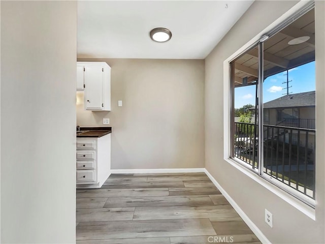1920 N H St Unit 251, Oxnard, CA 93036 - unfurnished dining area with light wood finished floors and baseboards