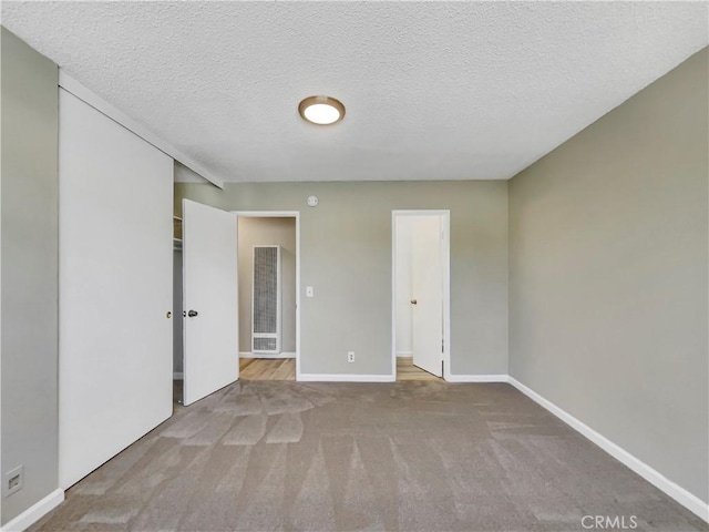 1920 N H St Unit 251, Oxnard, CA 93036 - carpeted spare room with a heating unit and a textured ceiling