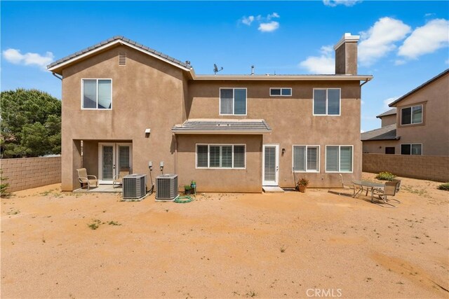 42639 Biscay, Lancaster, CA 93536 - rear view of house with a chimney, a fenced backyard, and stucco siding