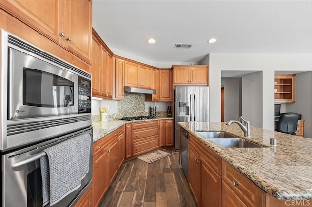 42639 Biscay, Lancaster, CA 93536 - kitchen featuring appliances with stainless steel finishes, dark wood finished floors, recessed lighting, under cabinet range hood, and decorative backsplash