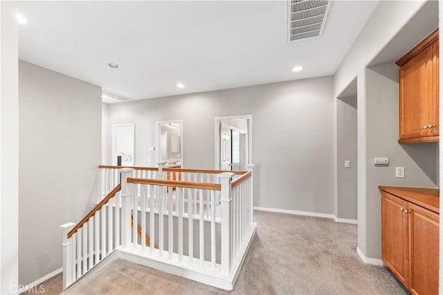 42639 Biscay, Lancaster, CA 93536 - hall featuring an upstairs landing, light colored carpet, and recessed lighting