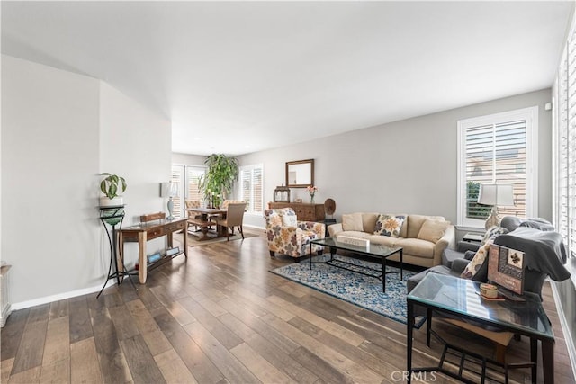 42639 Biscay, Lancaster, CA 93536 - living area featuring dark wood-style floors and baseboards