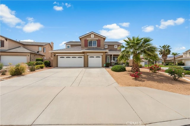 42639 Biscay, Lancaster, CA 93536 - traditional-style house with concrete driveway, stucco siding, and an attached garage