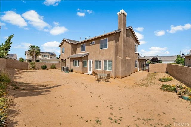 42639 Biscay, Lancaster, CA 93536 - rear view of property with stucco siding, a fenced backyard, and a chimney