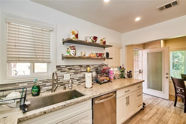 545 Camino De Teodoro, Walnut, CA 91789 - kitchen with dishwasher, tasteful backsplash, white cabinets, light wood-style floors, and light stone counters