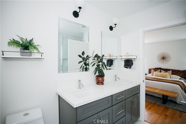 17442 Burma St, Encino, CA 91316 - ensuite bathroom featuring double vanity and wood finished floors