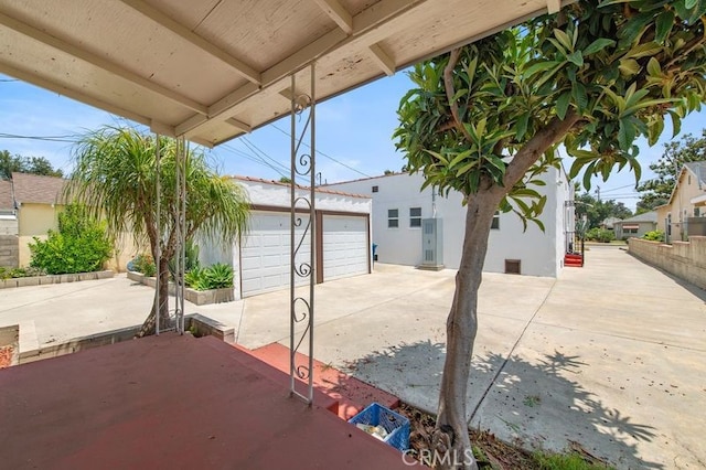 329 N Bushnell Ave, Alhambra, CA 91801 - view of patio featuring an outdoor structure and a detached garage