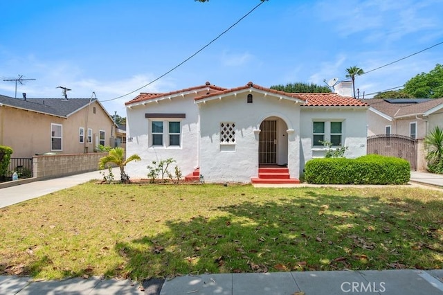329 N Bushnell Ave, Alhambra, CA 91801 - mediterranean / spanish-style house with a tiled roof and stucco siding